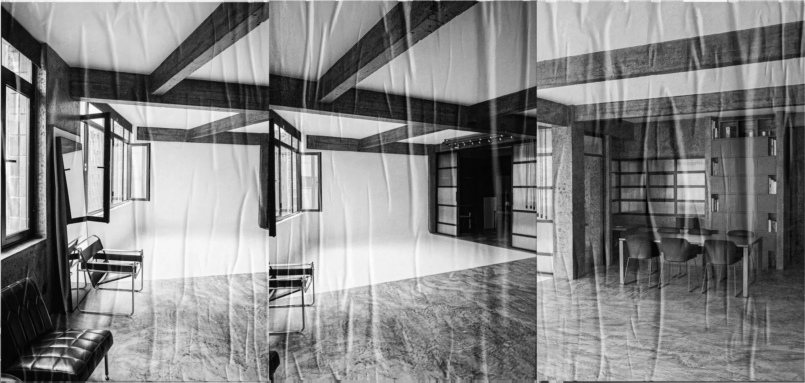 Black and white panoramic triptych of the studio with a folded-paper texture: a white cyclorama set, beams and windows, and a work area with a table and shelving.