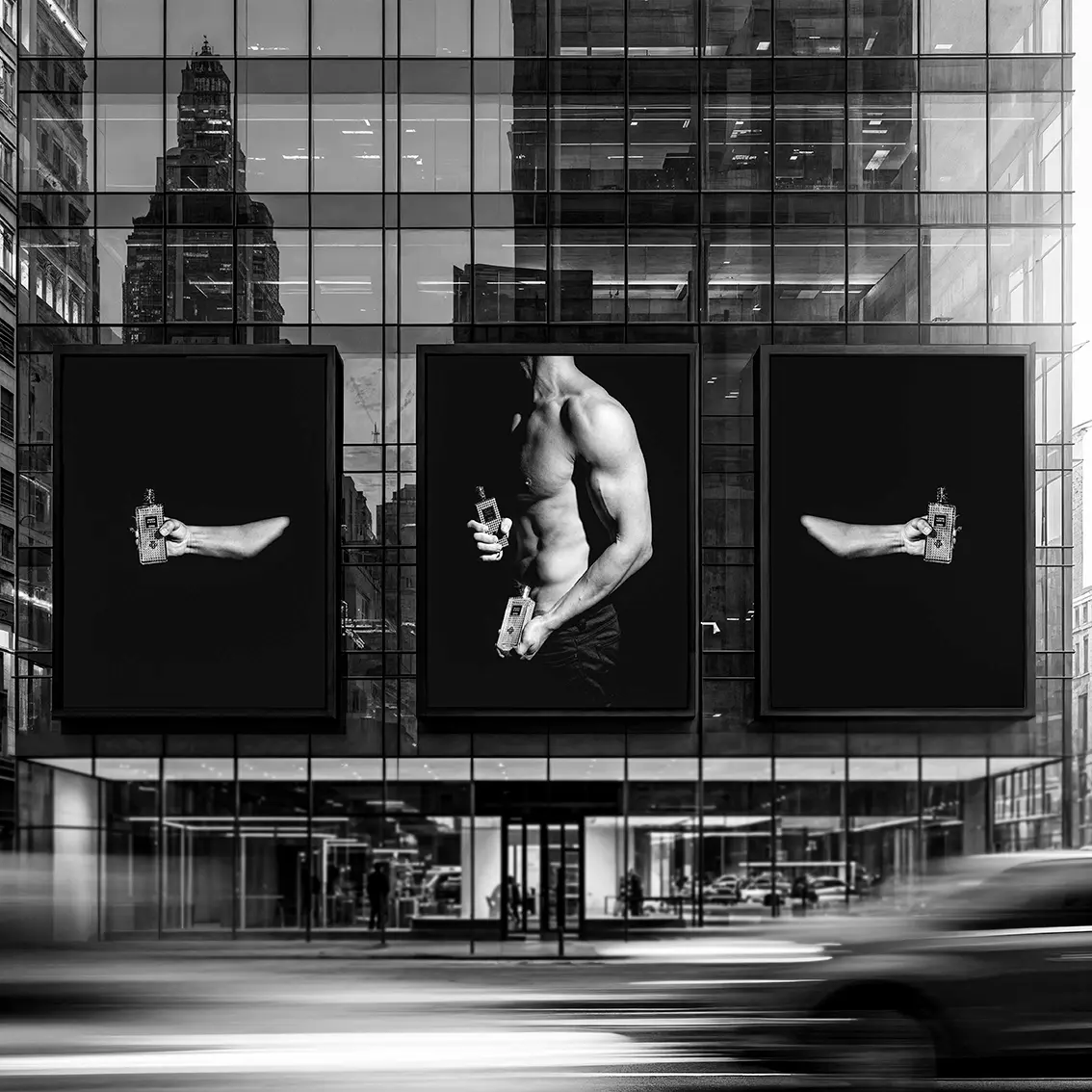Perris advertising photography across three posters on an urban glass facade, showing a male torso holding perfume bottles.