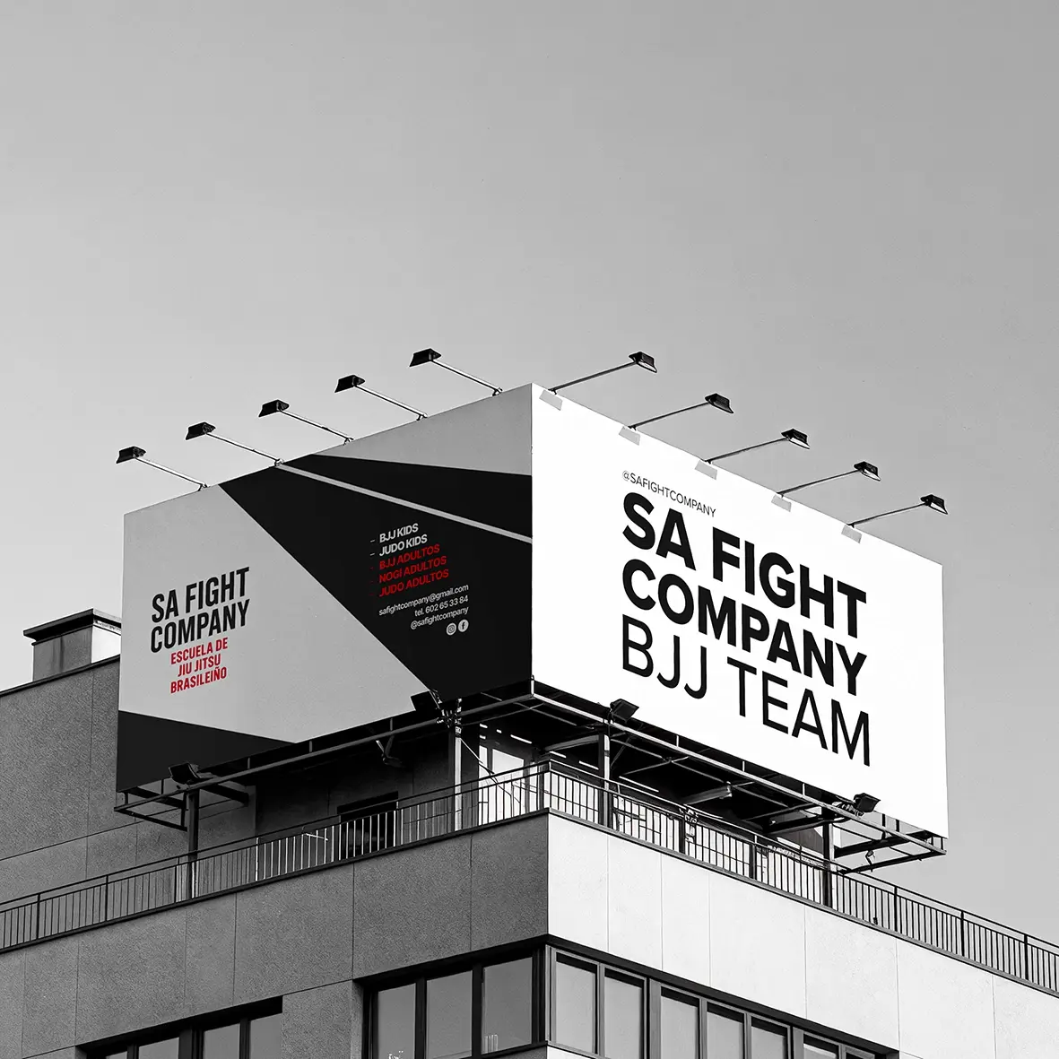 Double-sided rooftop billboard for SA Fight Company Brazilian jiu jitsu school, in black, white and red advertising design.